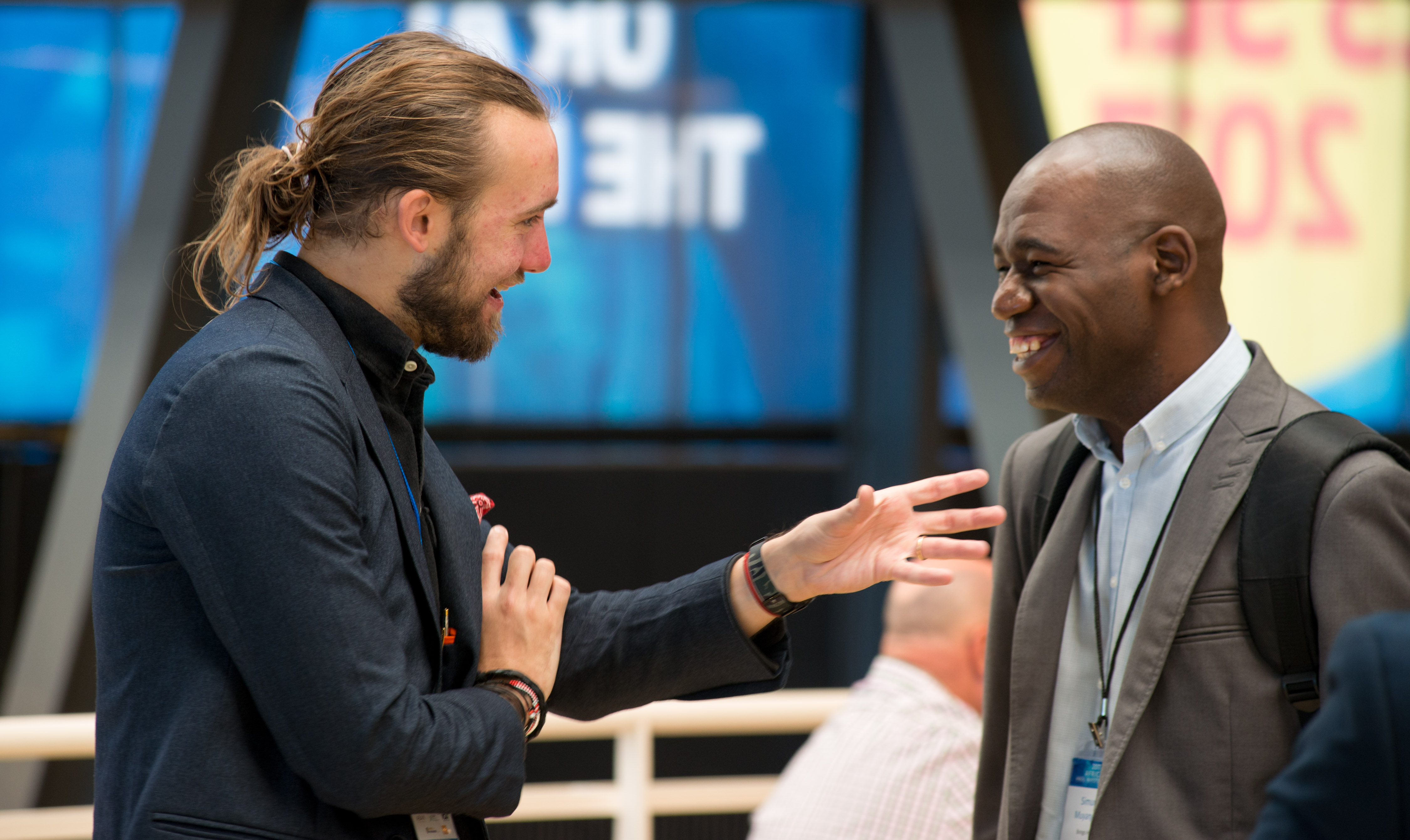 Founders and investors exchanging ideas during an investment gathering