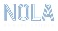 NOLA Dental Studio logo with large blue letters NOLA above smaller white text Dental Studio on a dark background.