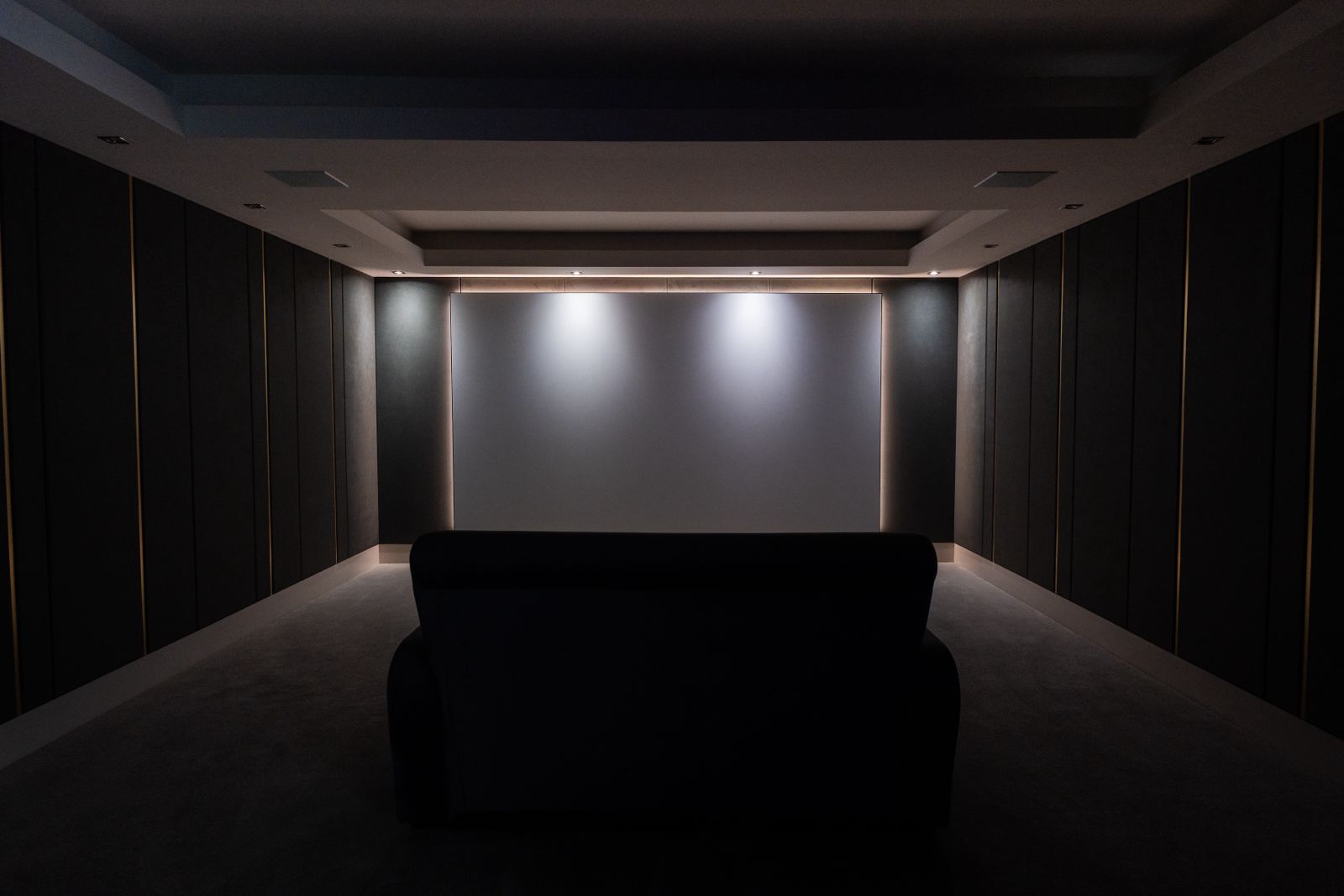 Custom home cinema seating and screen installation by Horizon Home Cinema