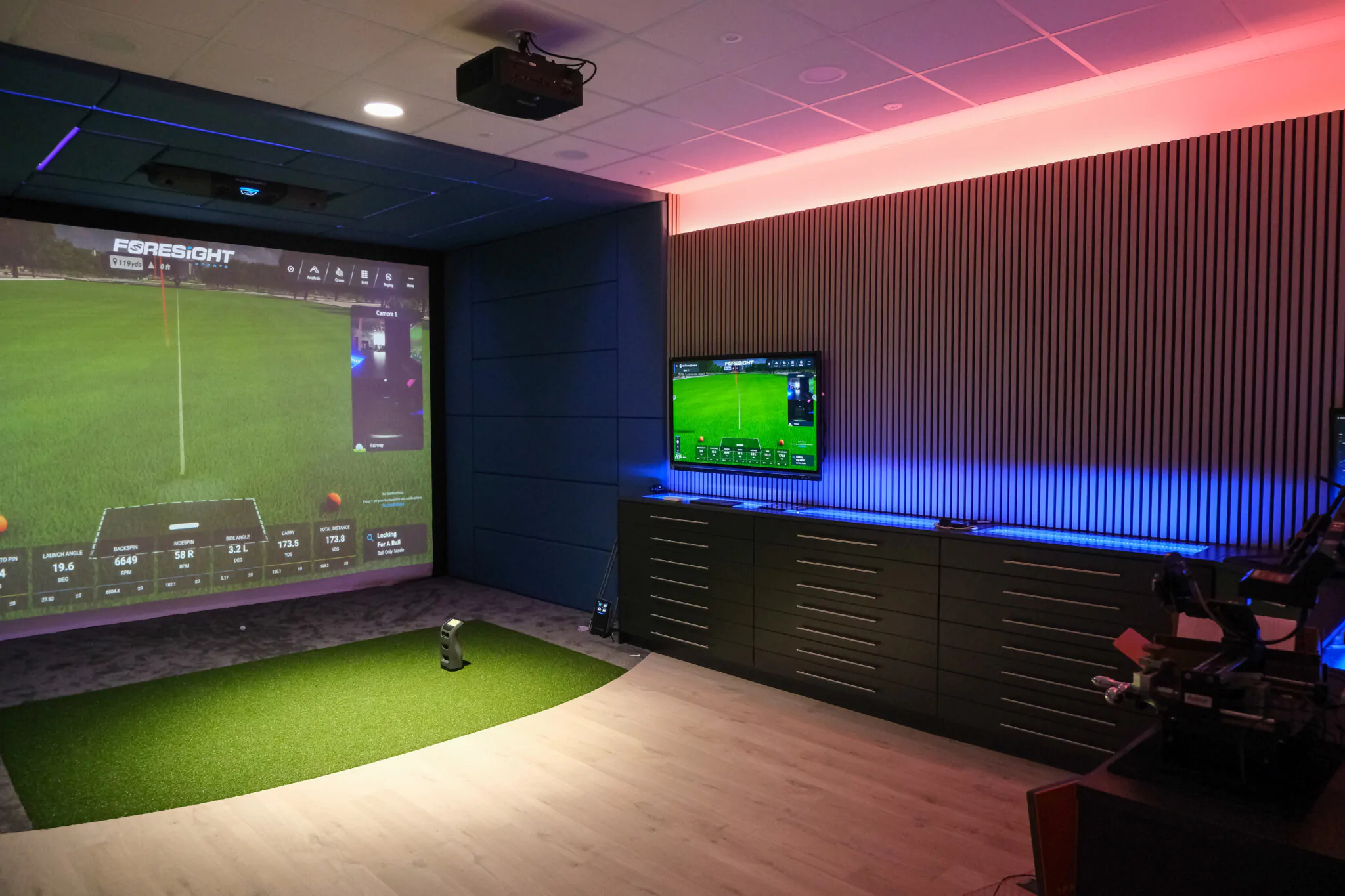 Custom golf simulator enclosure and screen
