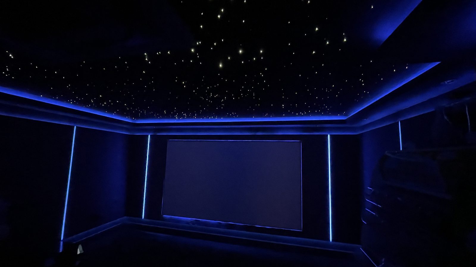 Basement home cinema screen wall with star ceiling lighting