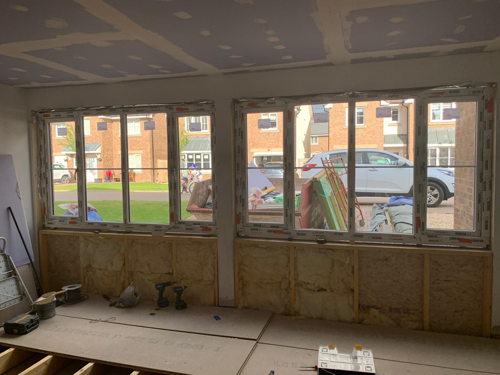 Bare garage before conversion, window wall