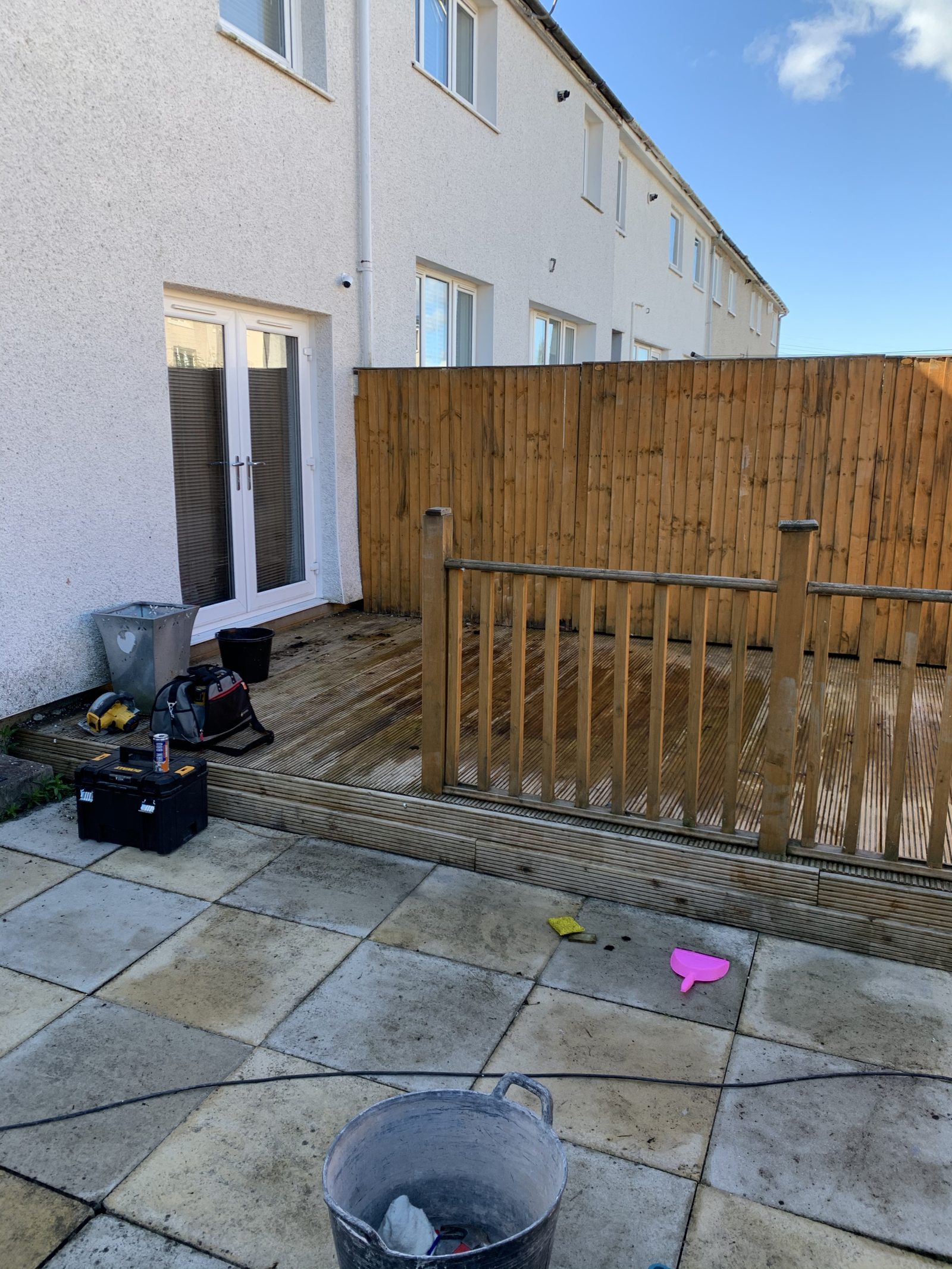Bare timber decking before garden cinema conversion