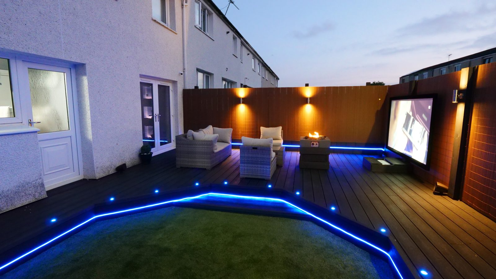 Finished garden cinema deck with LED lighting and outdoor screen