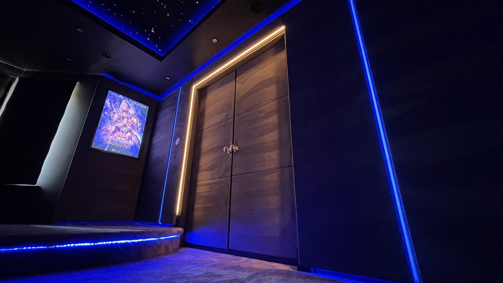 Dining room cinema entrance doors with blue LED lighting