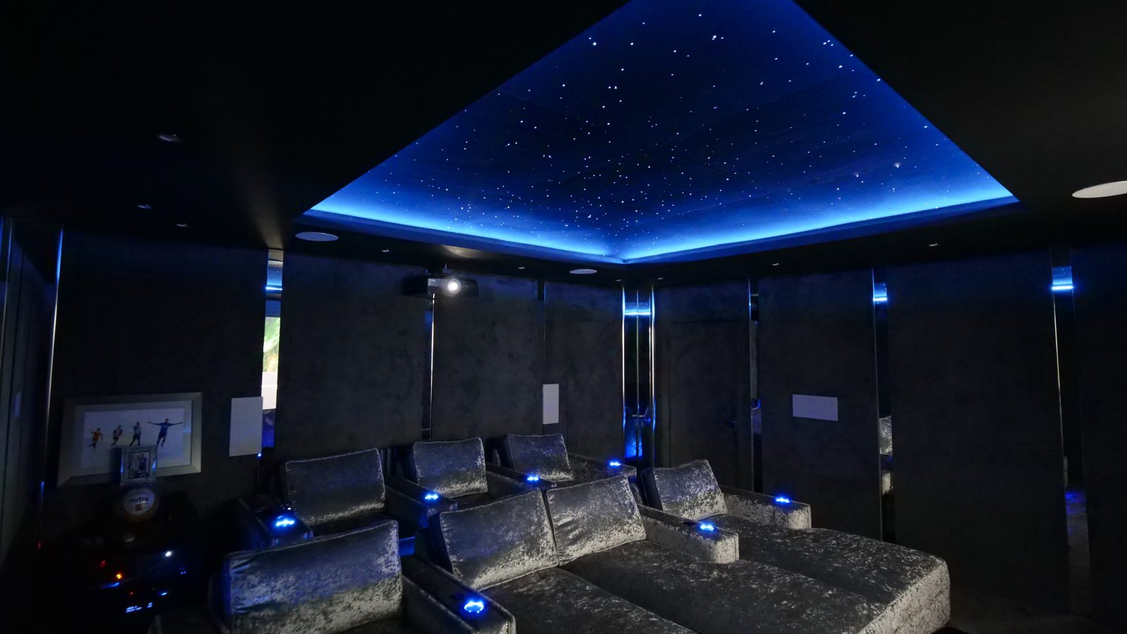 Milngavie garage cinema seating with blue ambient lighting