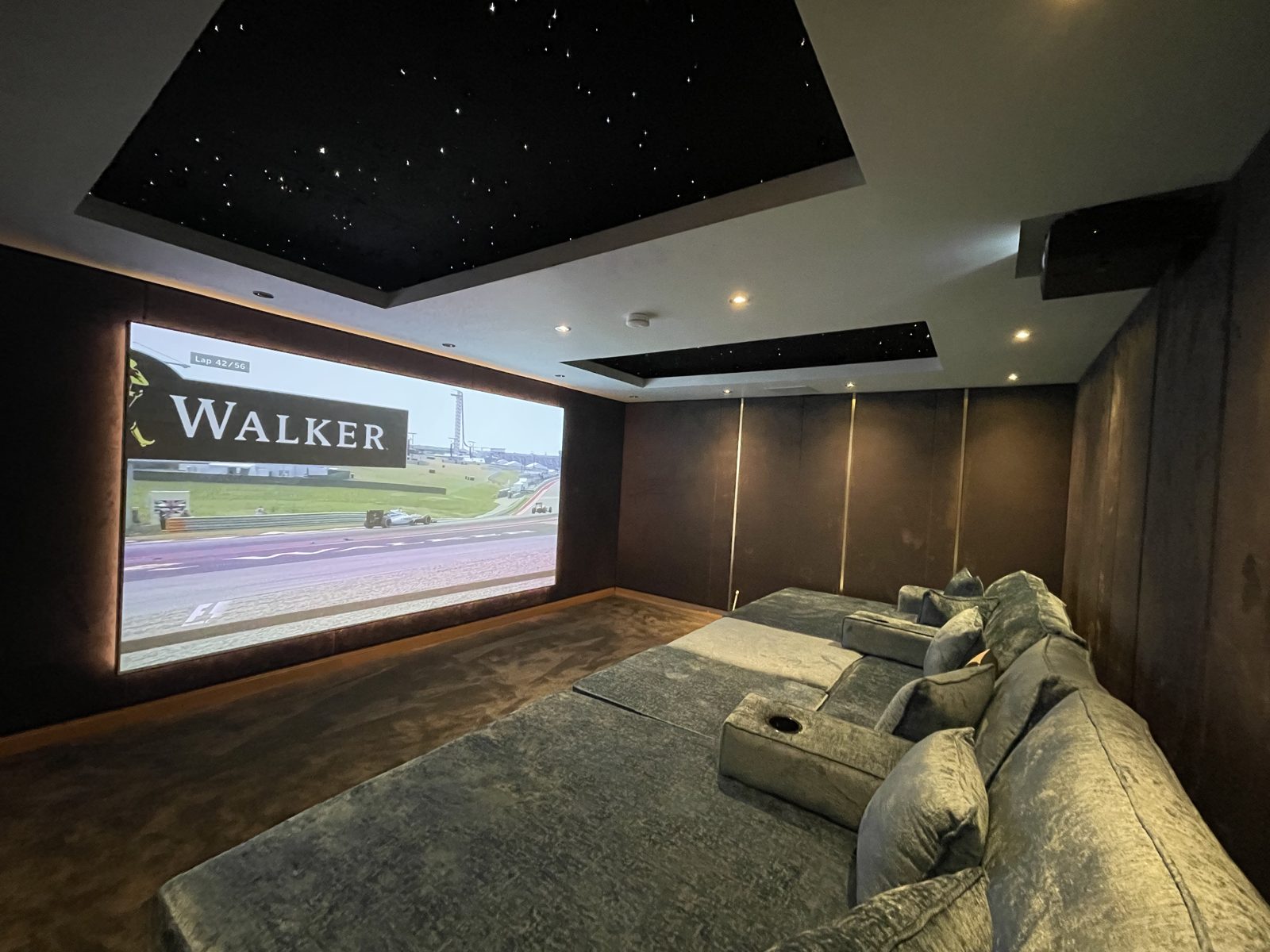 Finished spare room home cinema seating and screen wall