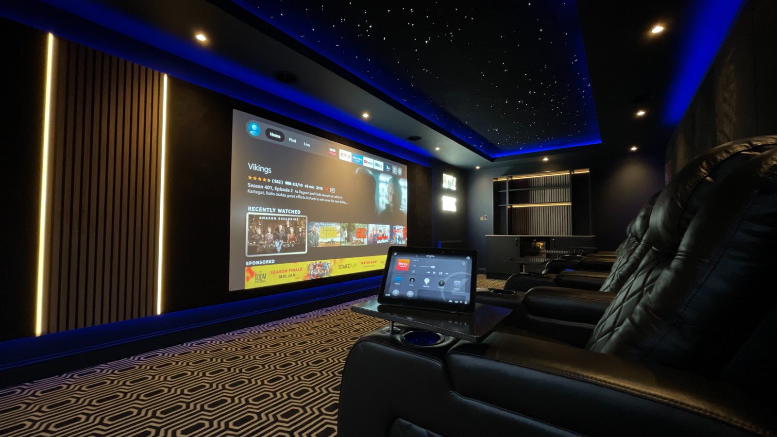 Finished Newton Mearns penthouse home cinema with patterned carpet and star ceiling