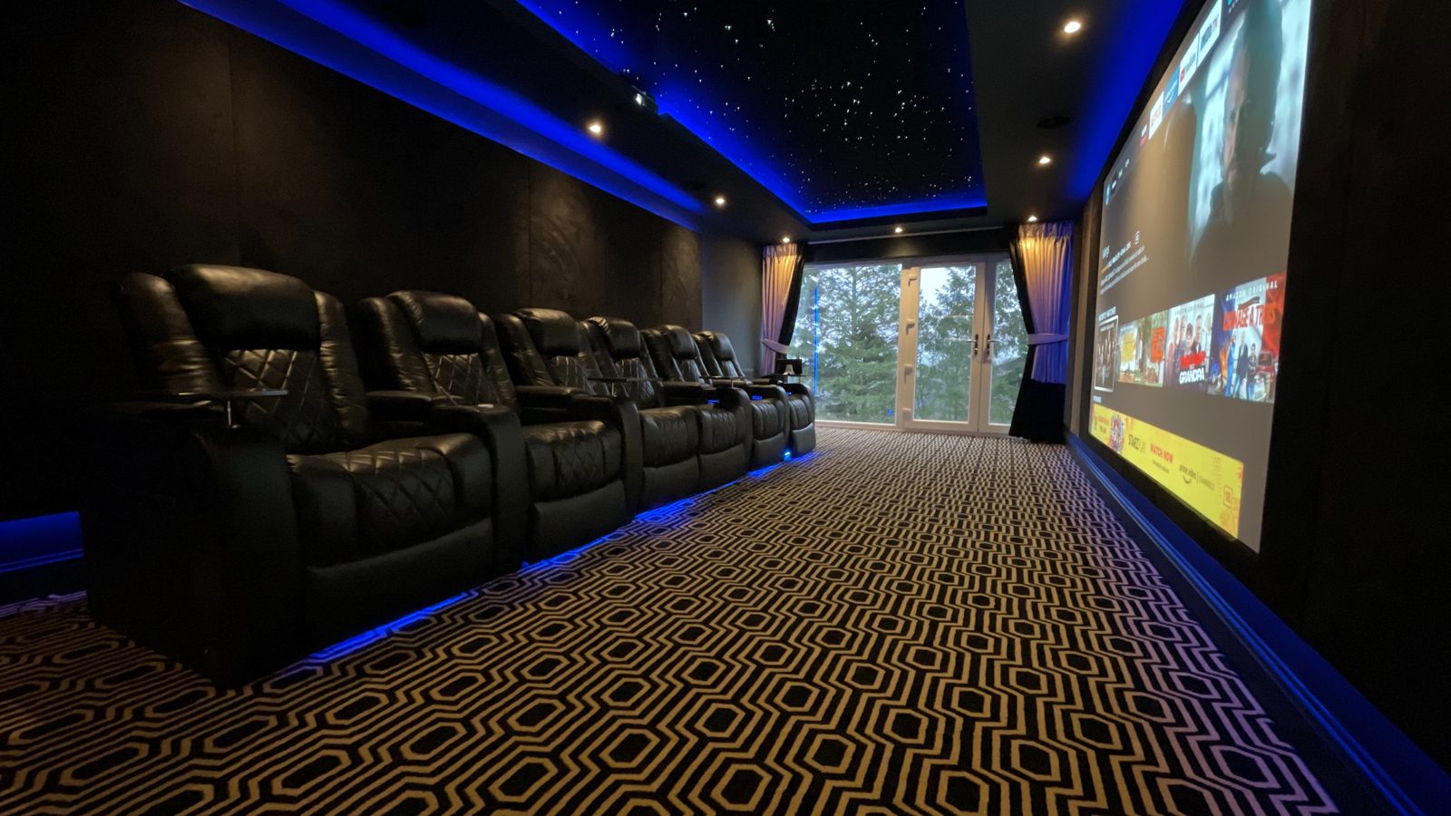 Finished Newton Mearns penthouse cinema seating with blue LED trim