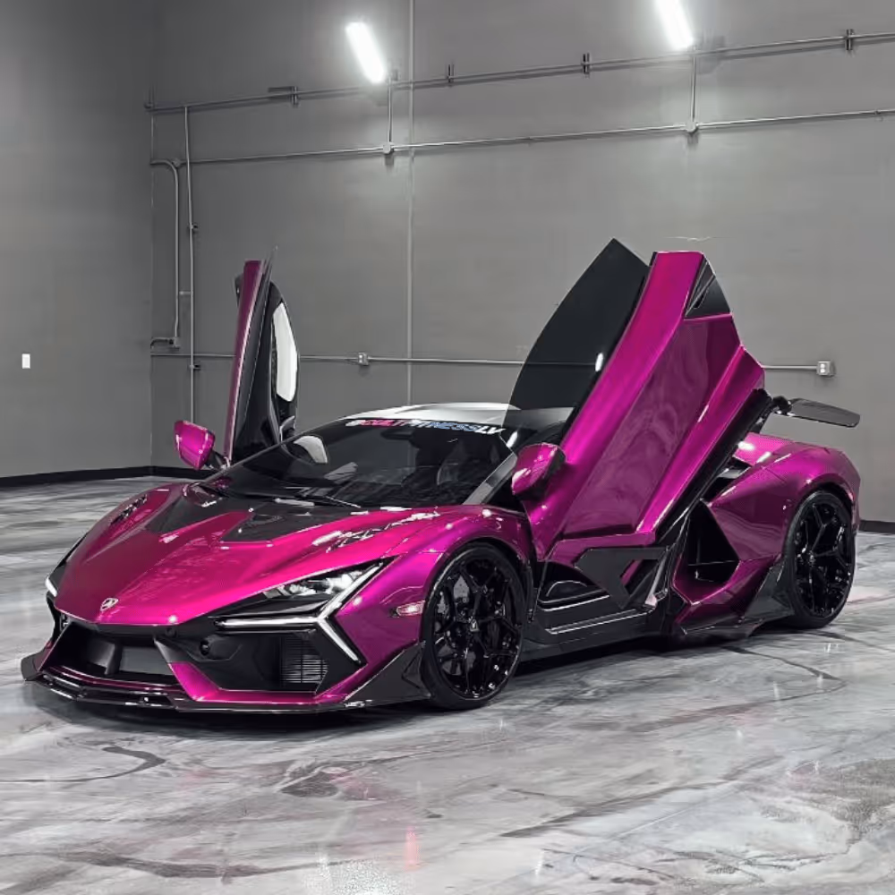 Glossy purple luxury sports car with butterfly doors open in a gray showroom.