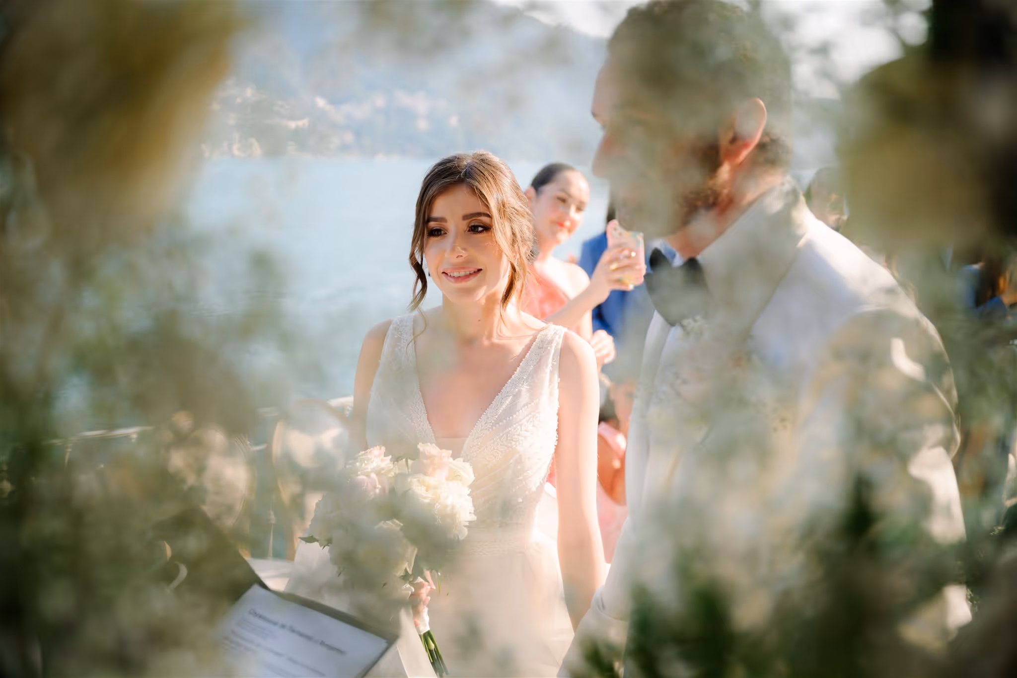 Elegant destination wedding on Lake Como with the couple framed by water and mountains