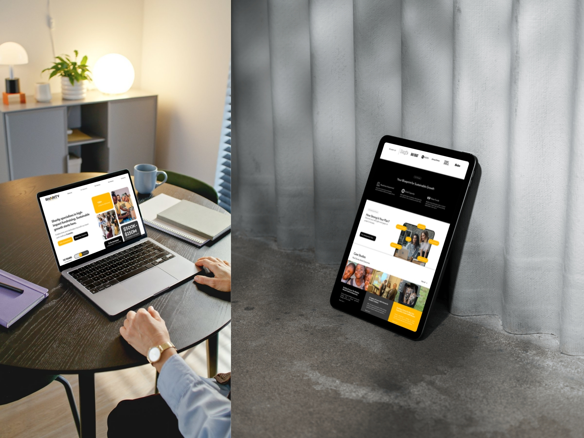 Person using a laptop showing a fundraising website homepage at a round wooden table with notebooks and a coffee mug, next to a tablet displaying the same website leaning against white curtains on a concrete floor.