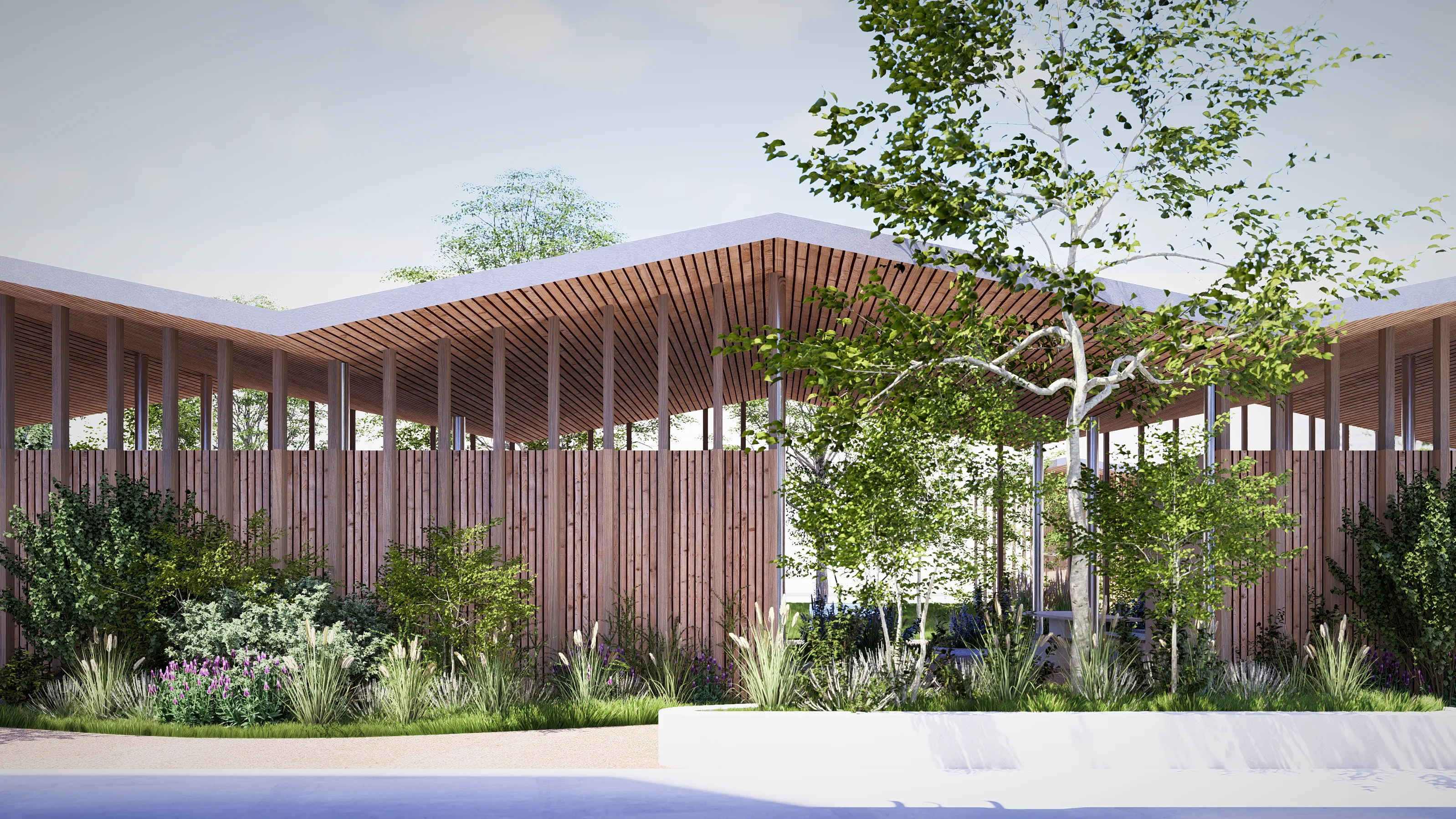 Modern two-story apartment building with wooden doors, exterior stairway, and landscaped garden with trees and shrubs.