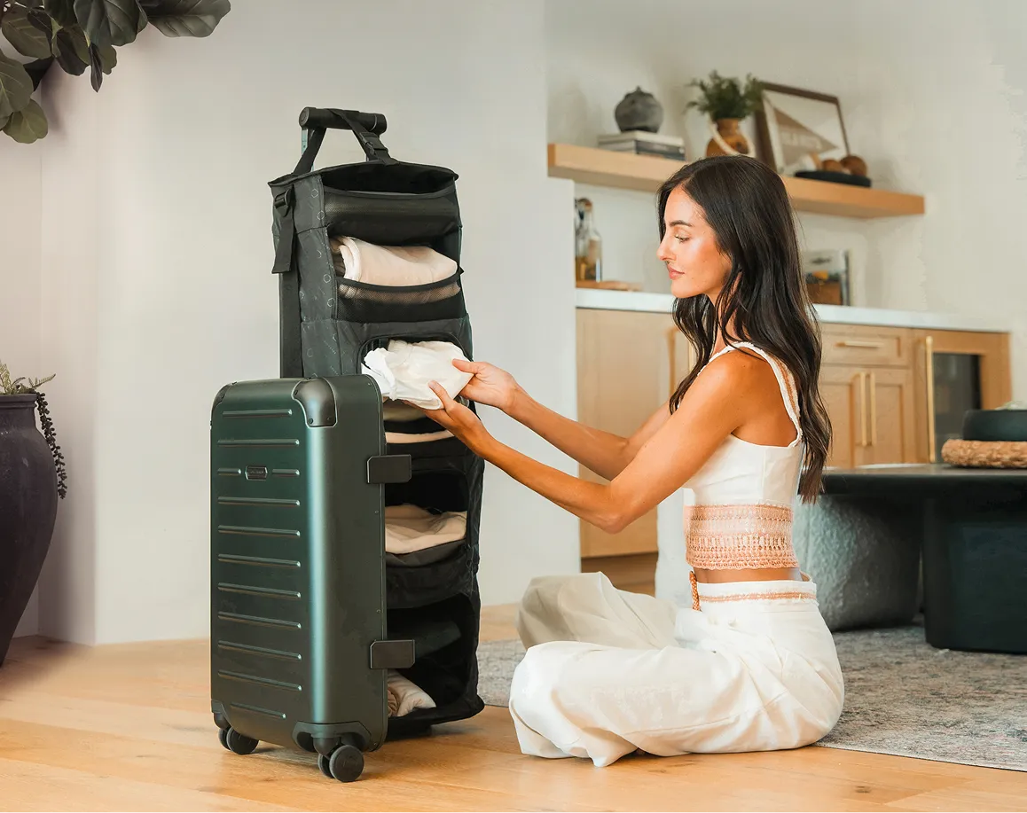 Traveler using Solgaard luggage designed for organized travel