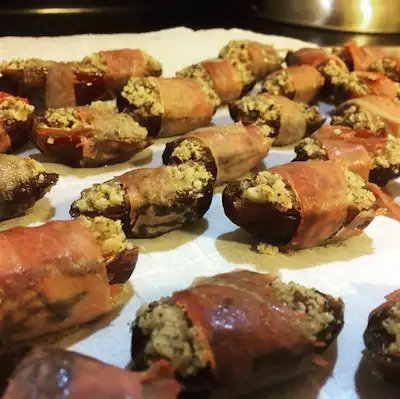Pitted dates stuffed with an herby ground nut mixture, and wrapped in a thin slice of prosciutto 