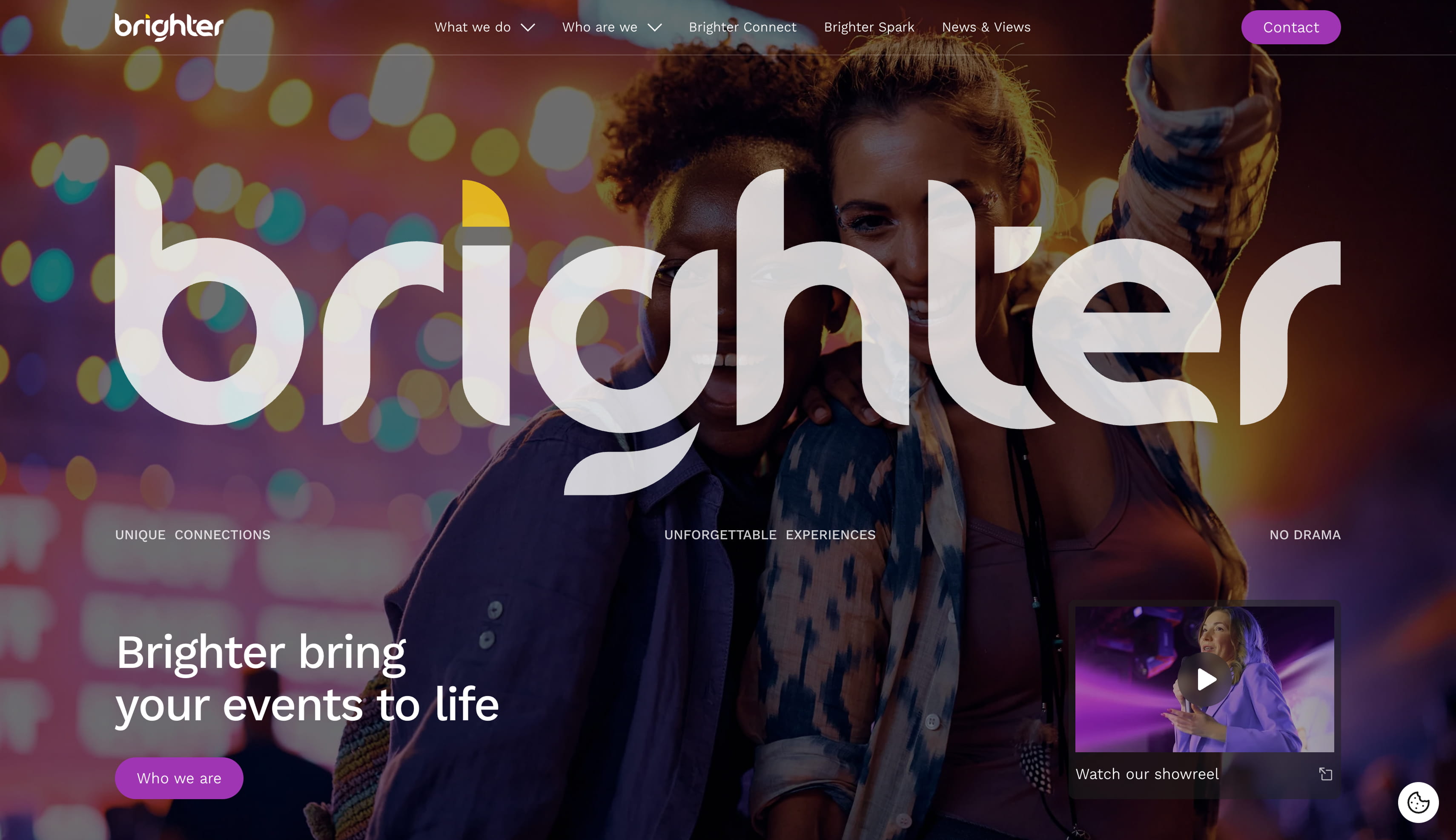 Two smiling women in colorful lighting with arms around each other, overlayed by large Brighter logo and website navigation text.