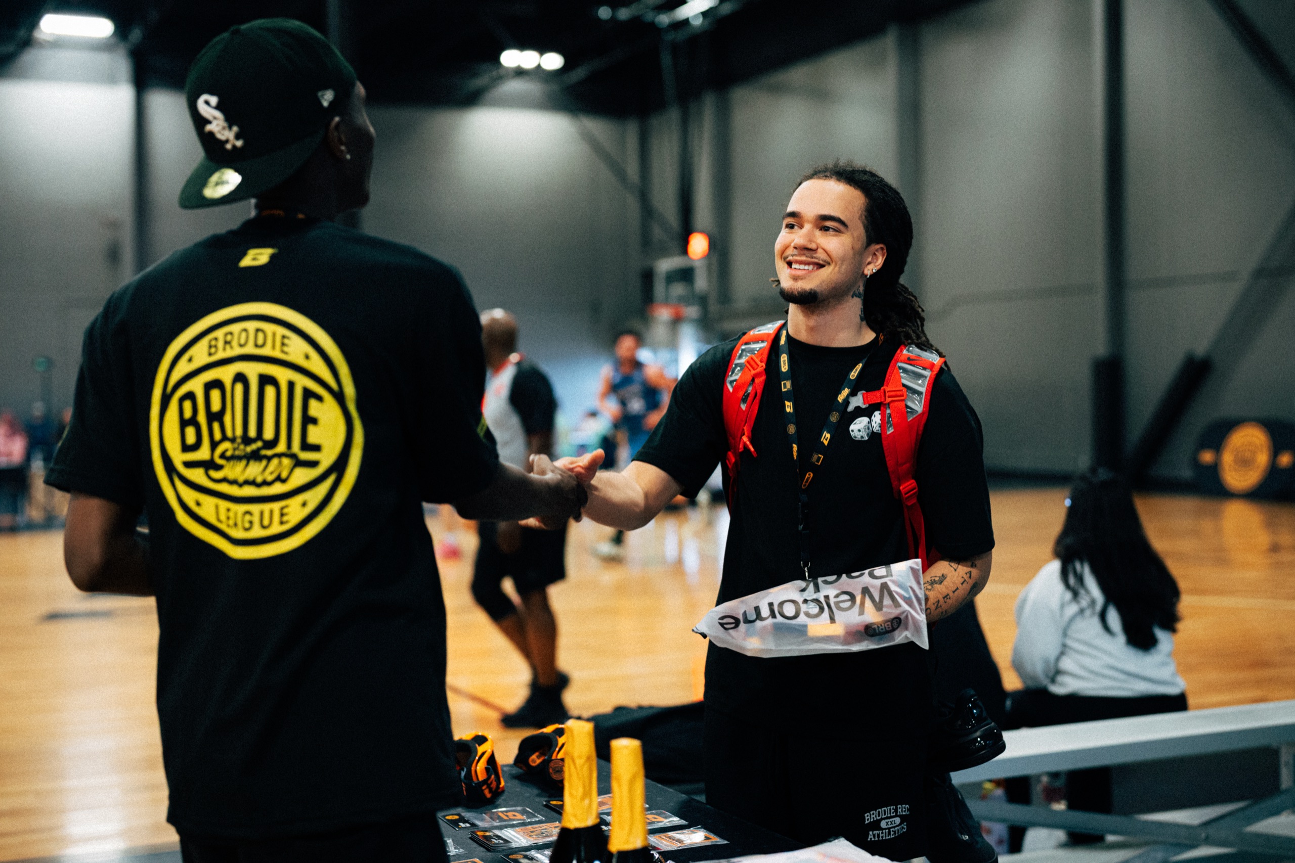 A Brodie League Ambassador welcoming a new athlete