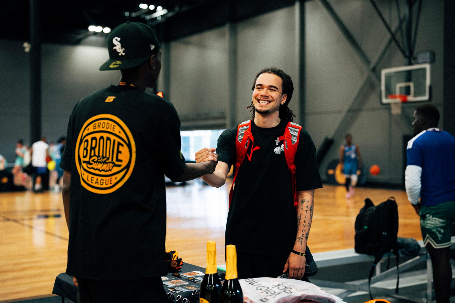 A Brodie League Ambassador welcoming a new athlete