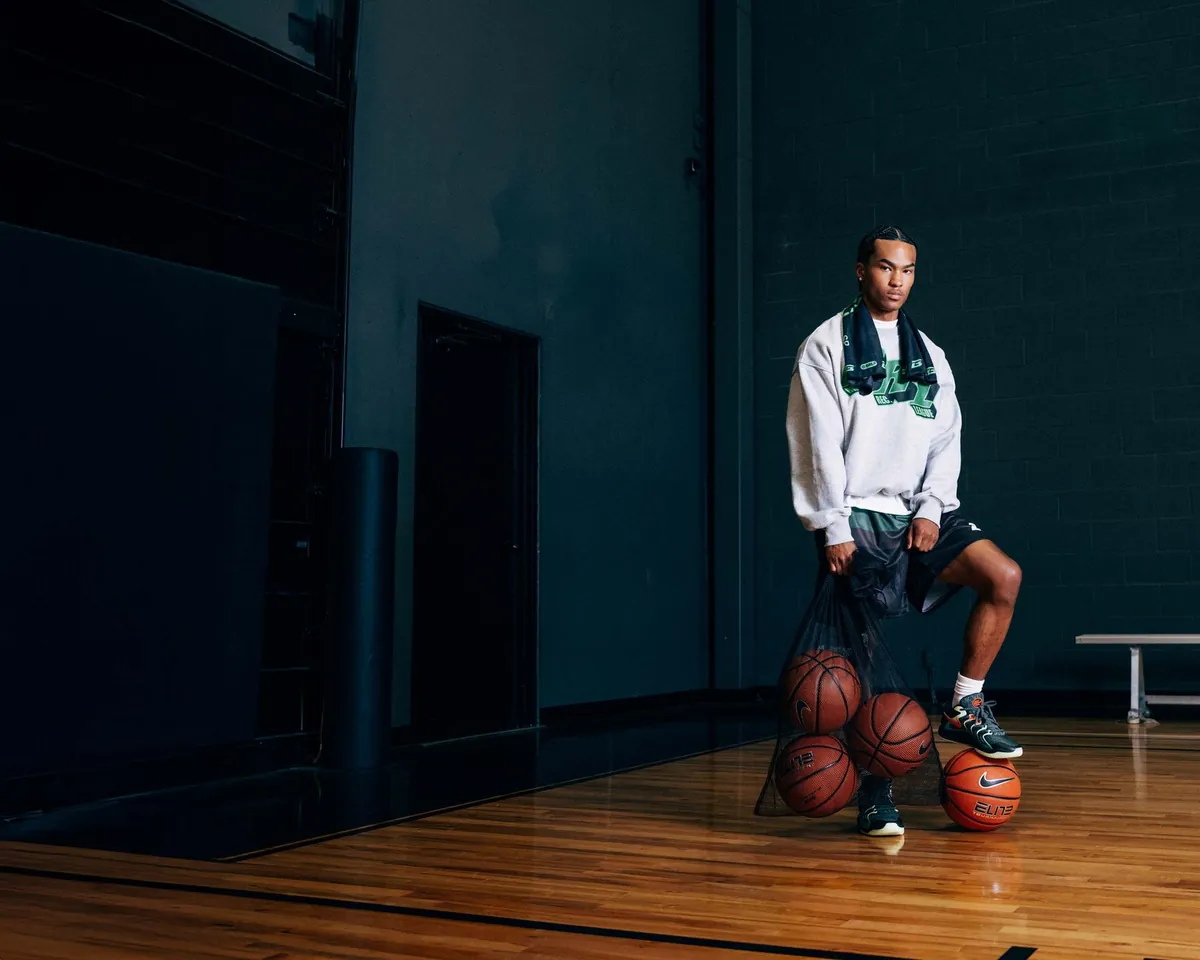 BRODIE athlete with a bag of basketballs