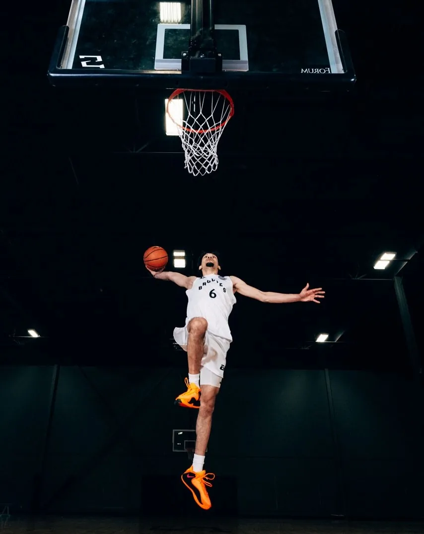 BRODIE athlete going up for a dunk