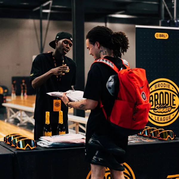 Brodie League Manager greeting an athlete at check-in