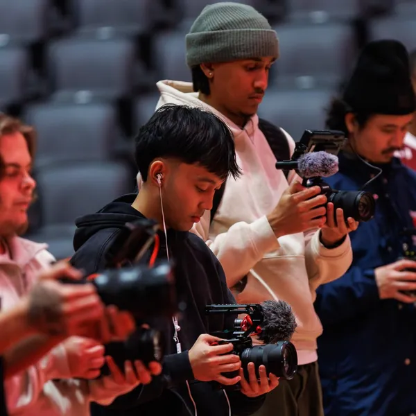 Brodie media team filming courtside
