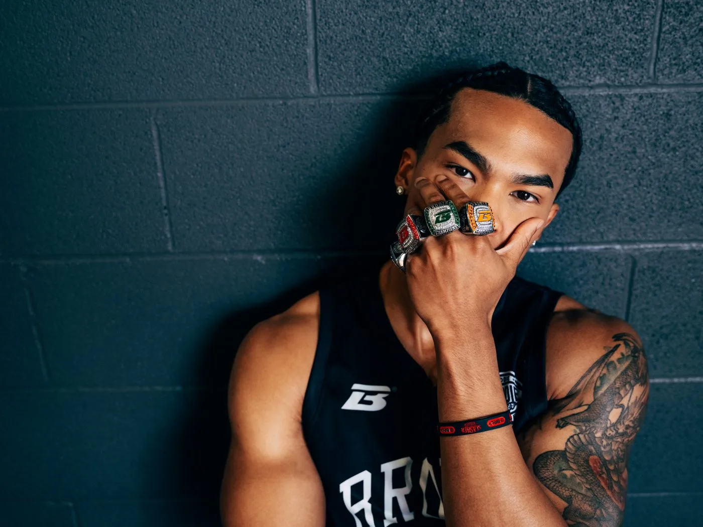 Brodie athlete showing off his championship rings