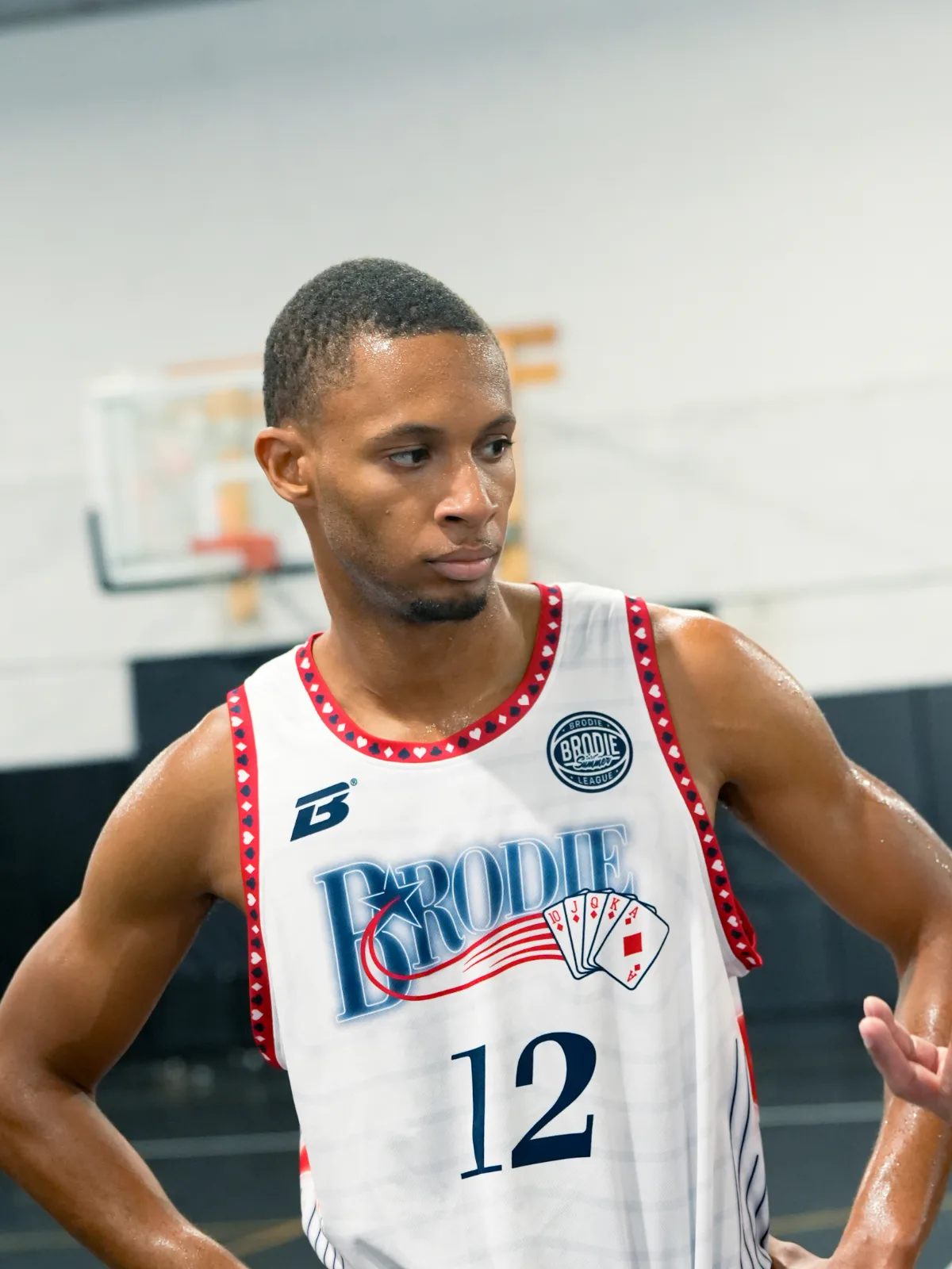 Brodie athlete in a white Brodie jersey in the gym