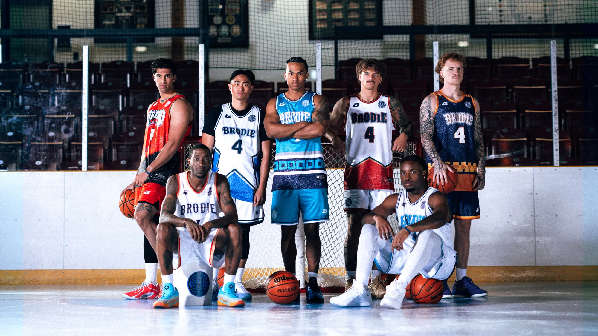 Brodie athletes in game jerseys lined up in an arena