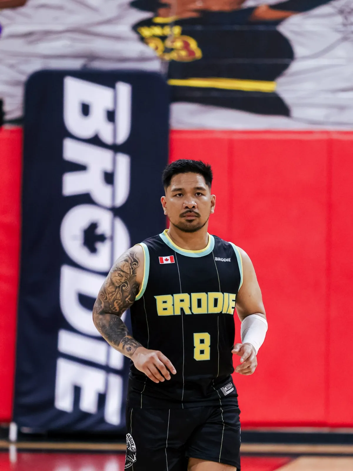 Mark M., BRODIE athlete in a number 8 jersey on court