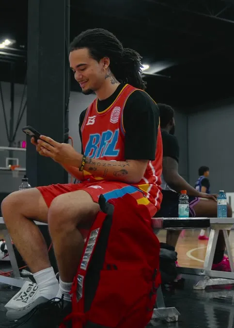 Athlete on the bench while the Brodie media team films