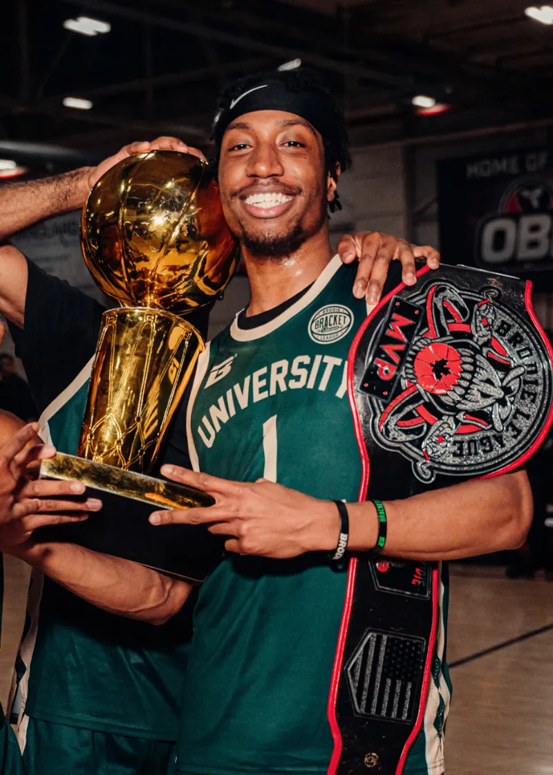 All-Star winners holding the trophy and championship belt