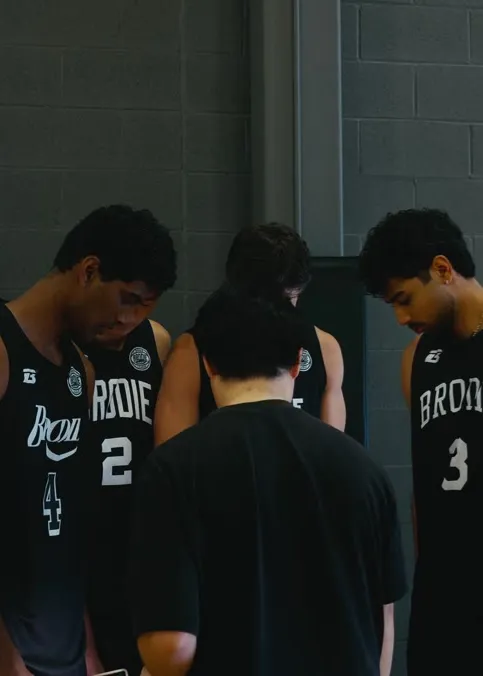 Brodie team huddled before a playoff game