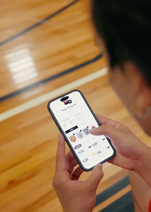Athlete checking game stats in the Brodie App
