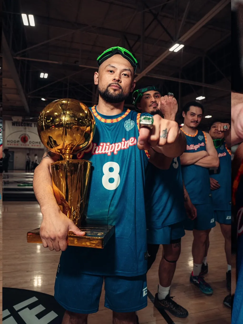 Culture Cup champion holding the trophy in front of his team