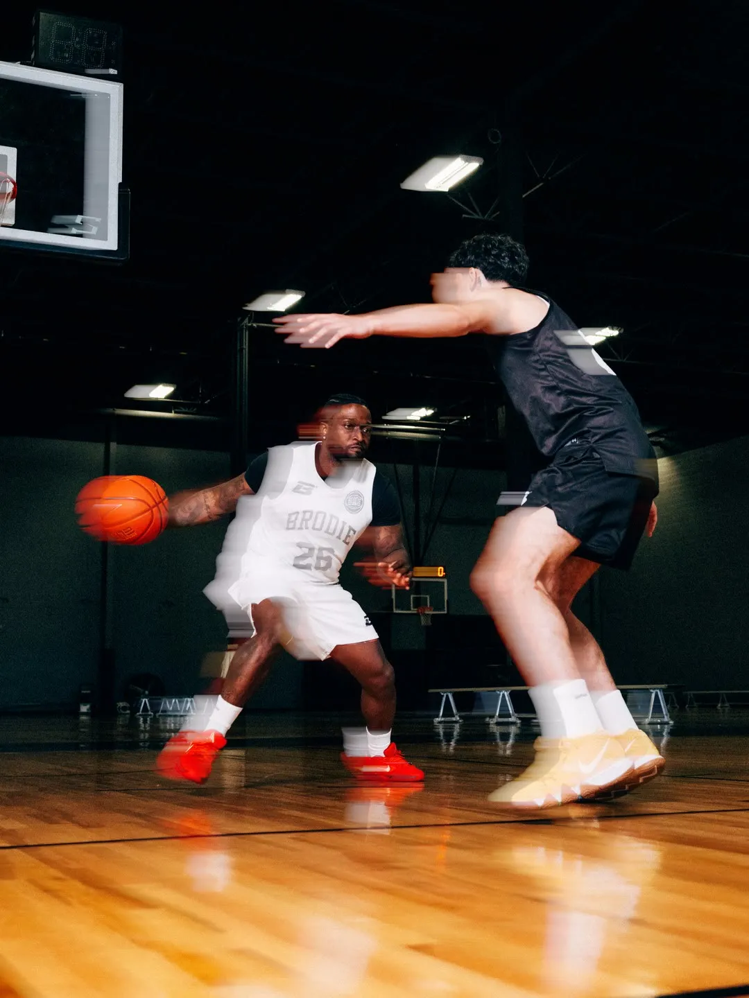 Brodie athletes playing a fast break in game jerseys