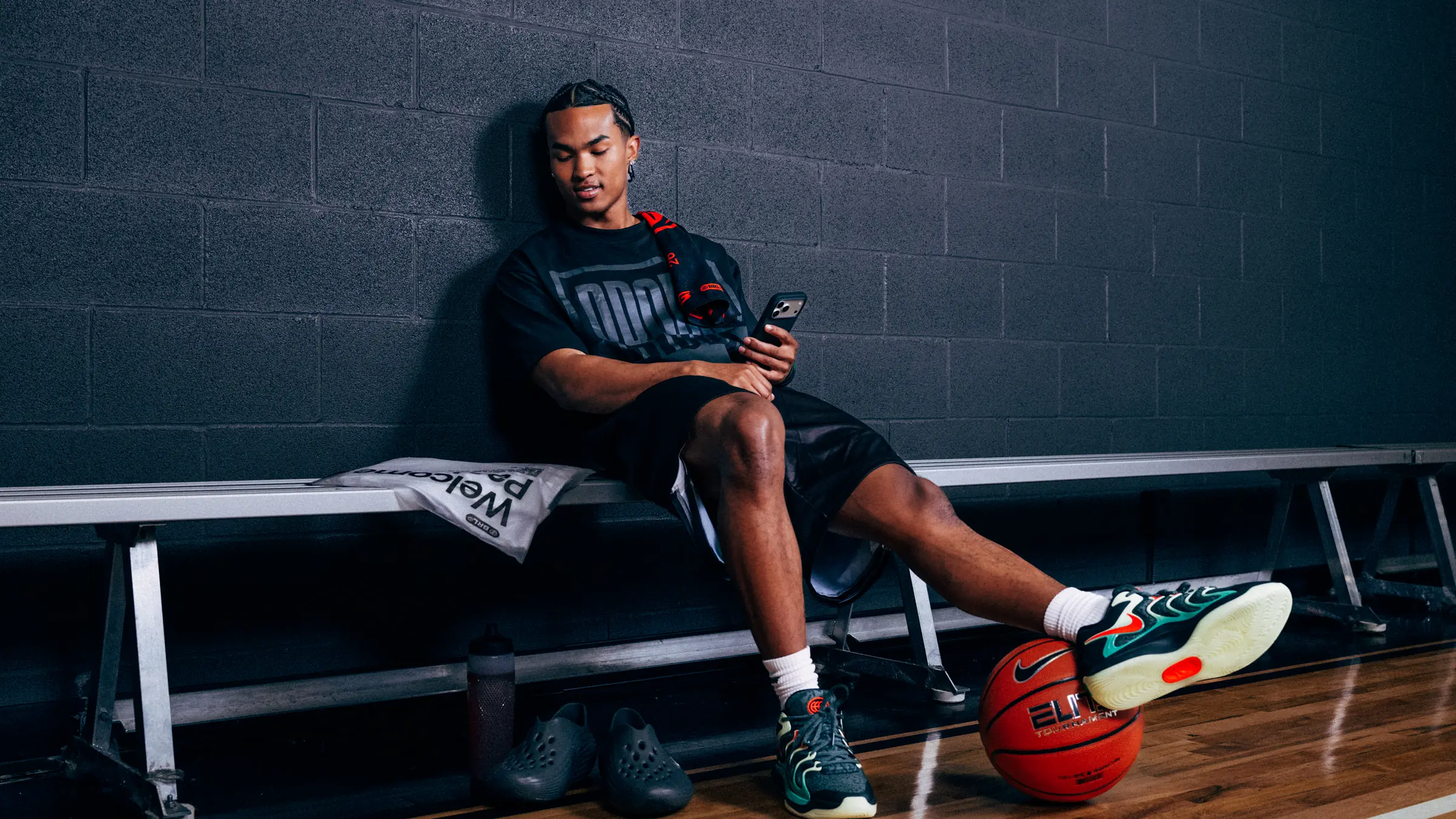 A BRODIE athlete on his own on a gym bench, signing up on his phone