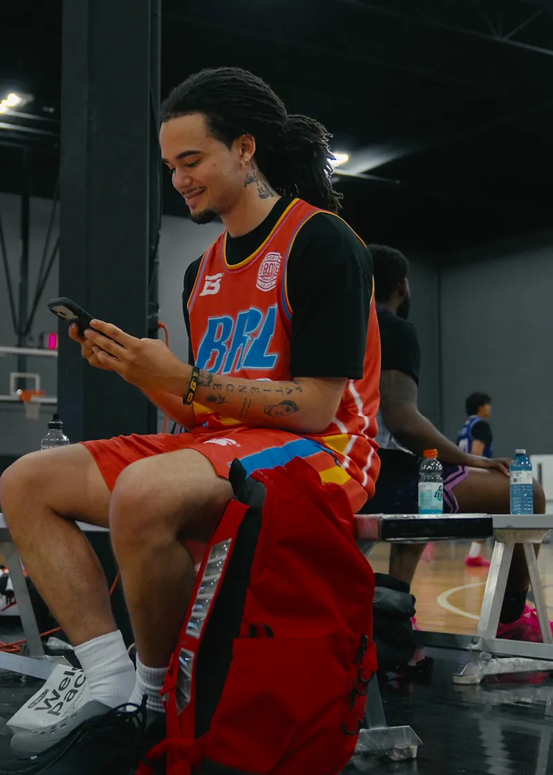 Athlete on the bench while the Brodie media team films