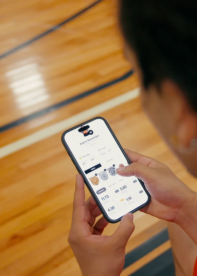 Athlete checking game stats in the Brodie App
