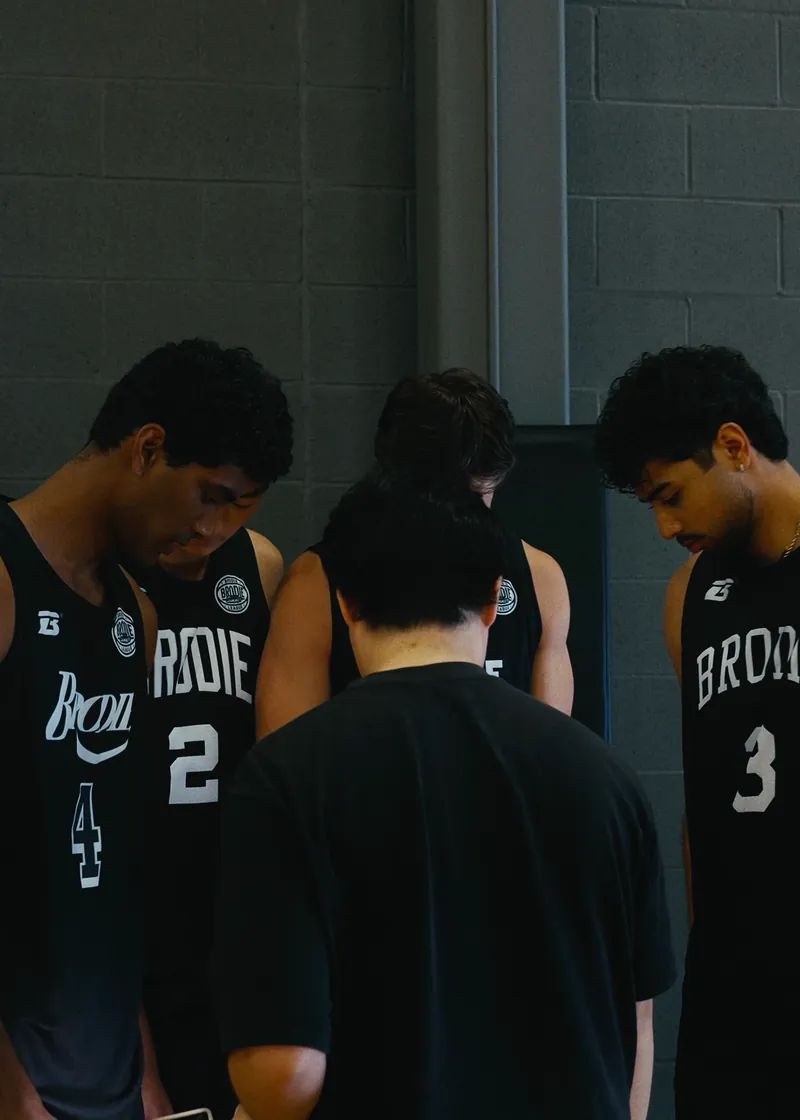 Brodie team huddled before a playoff game