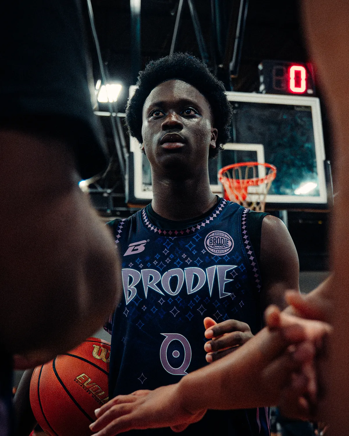 BRODIE athlete in a BRODIE jersey standing in the team huddle