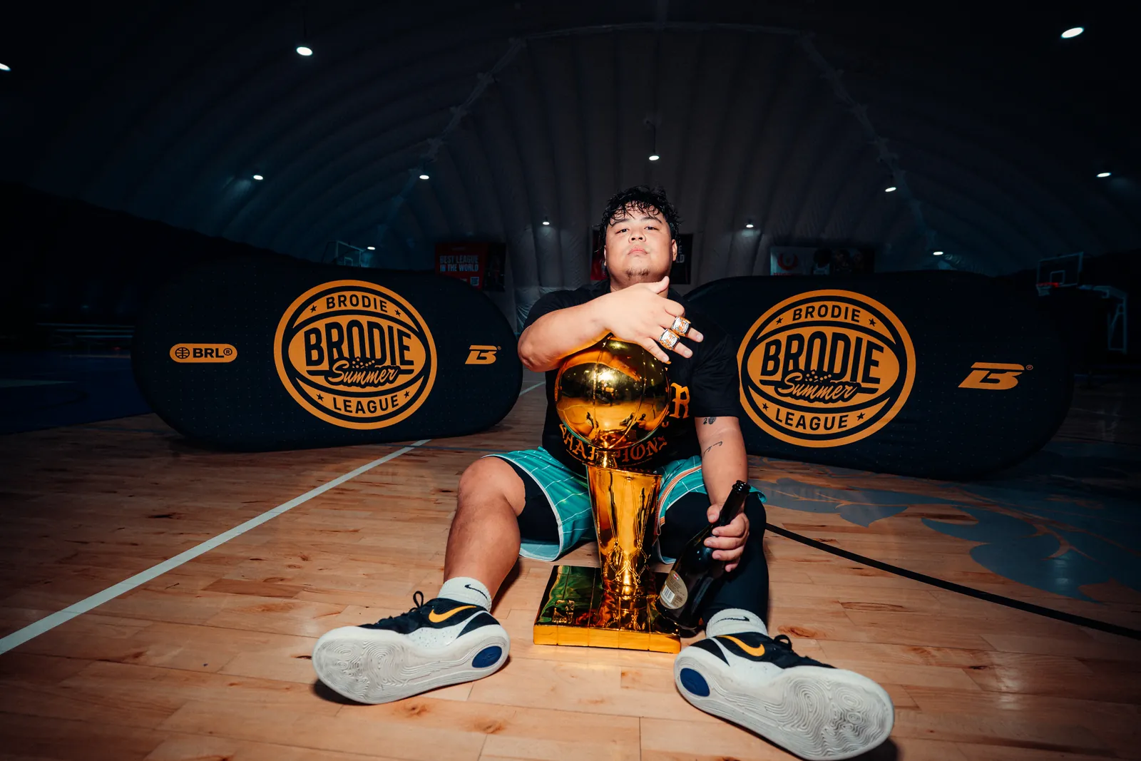 BRODIE Summer League champion kneeling with the trophy