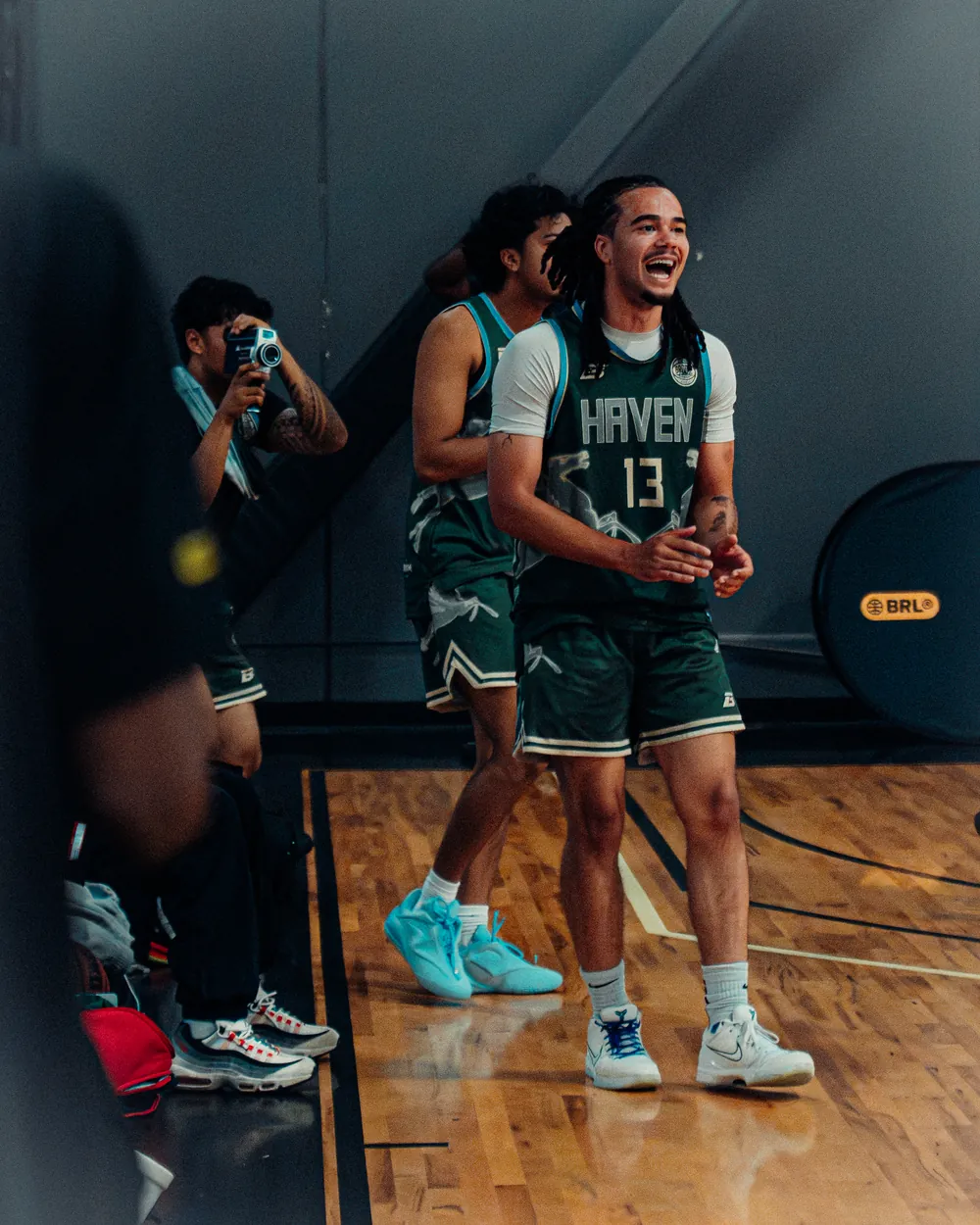 BRODIE athlete smiling on the sideline during a game