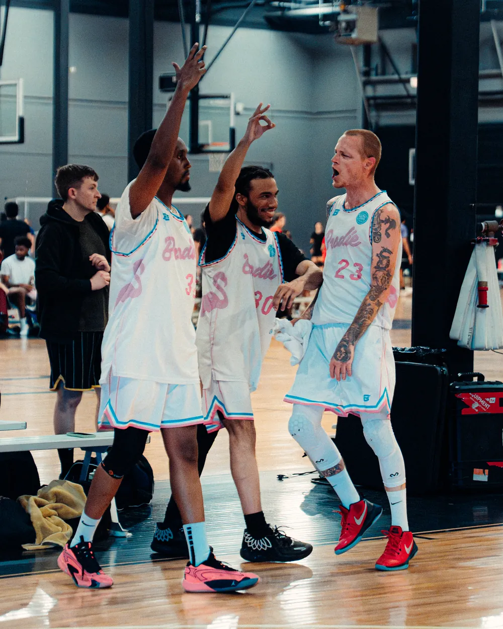 BRODIE athletes celebrating together on court