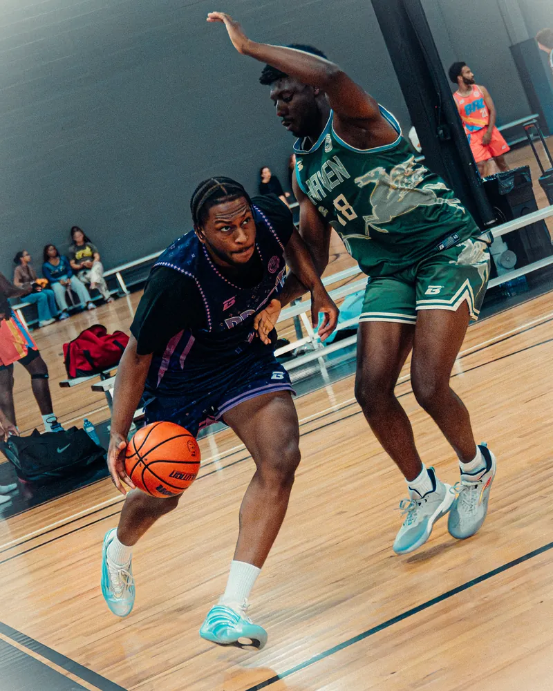 BRODIE athlete driving to the basket on game night