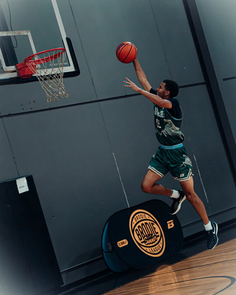 BRODIE athlete going up for a layup