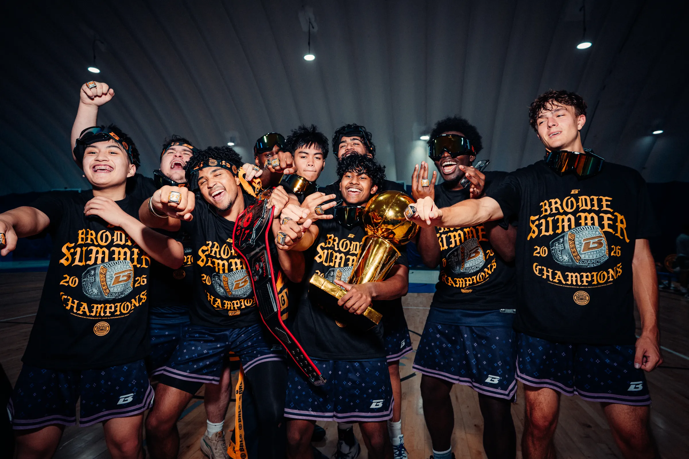 BRODIE champions celebrating with the trophy after a playoff final