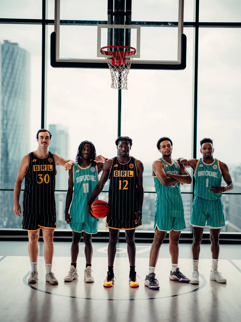 BRODIE team lined up on court in front of the hoop