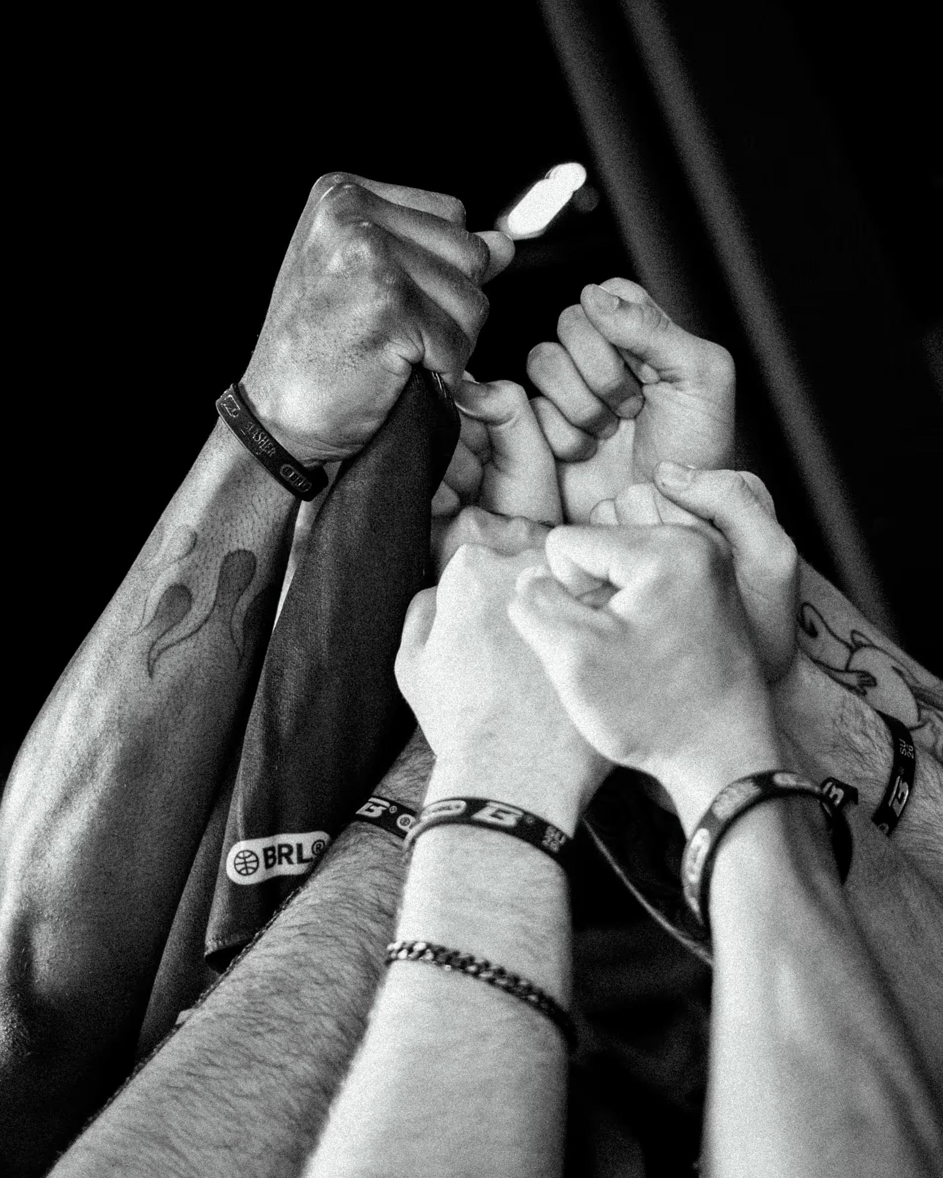 Hands stacked together in a team huddle