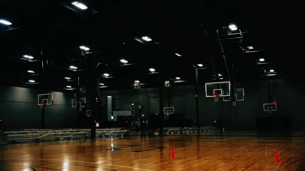 An empty BRODIE gym with the court lights on